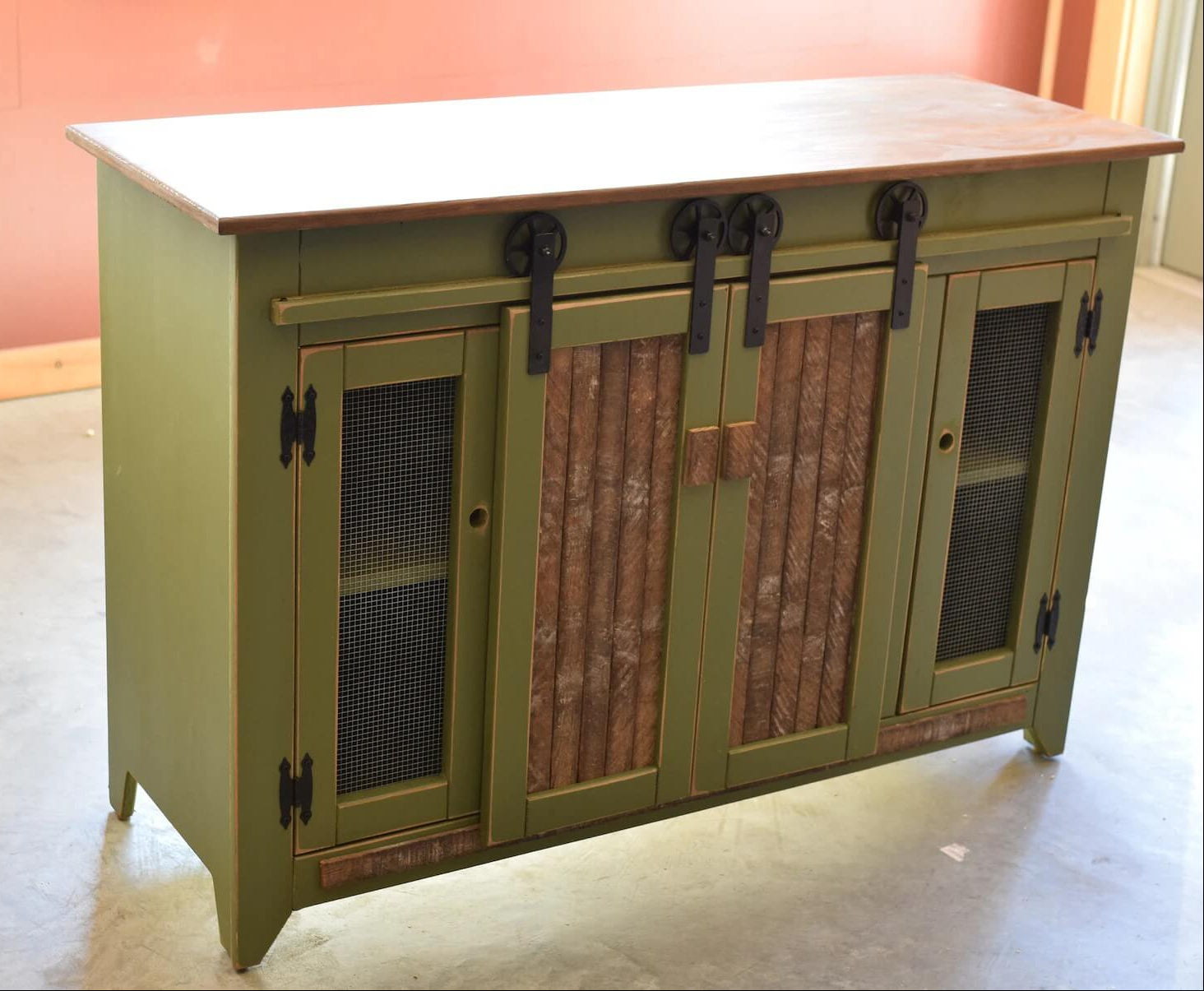 rustic wooden cabinet with green doors