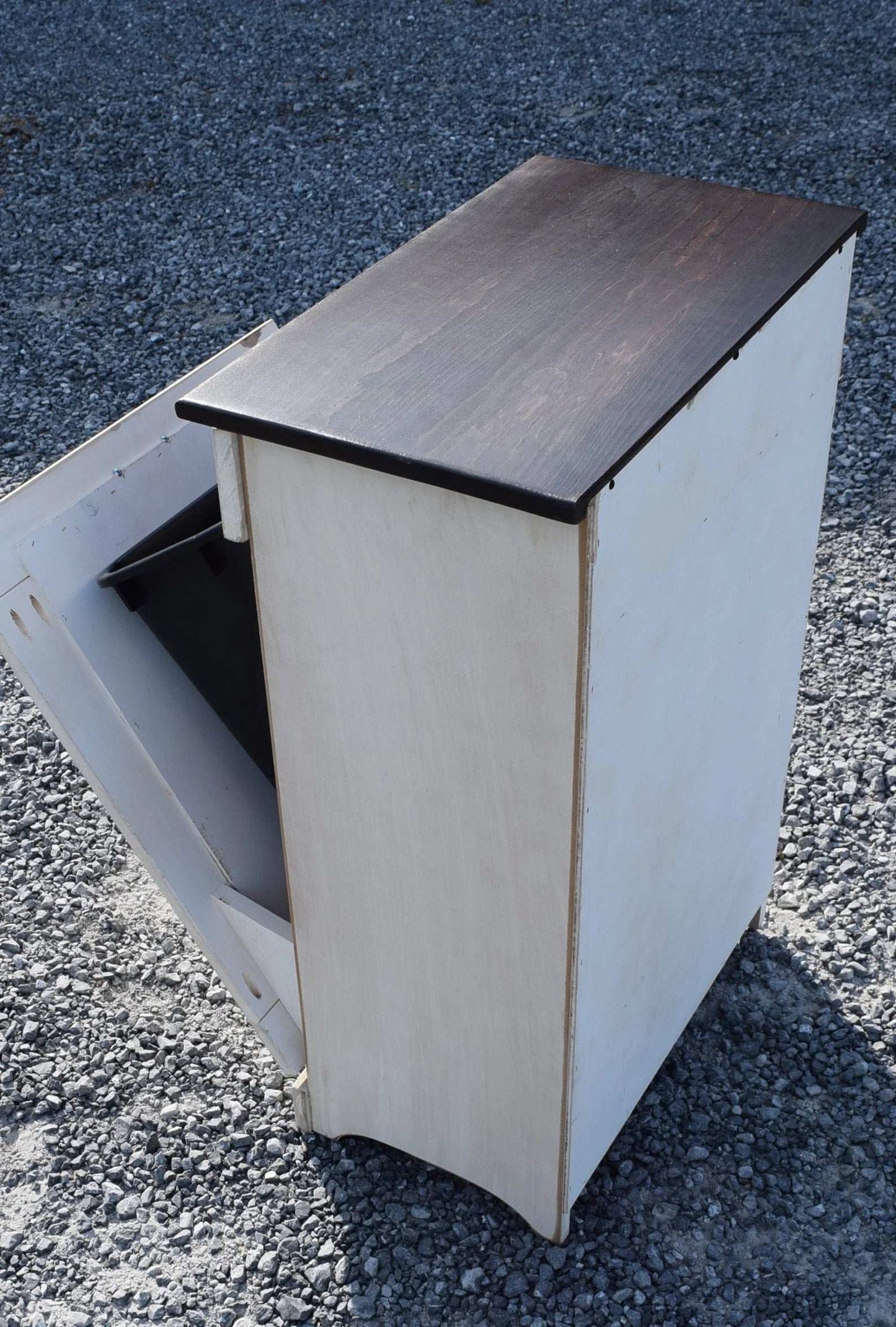 Antique white and rich tobacco back view of trash bin
