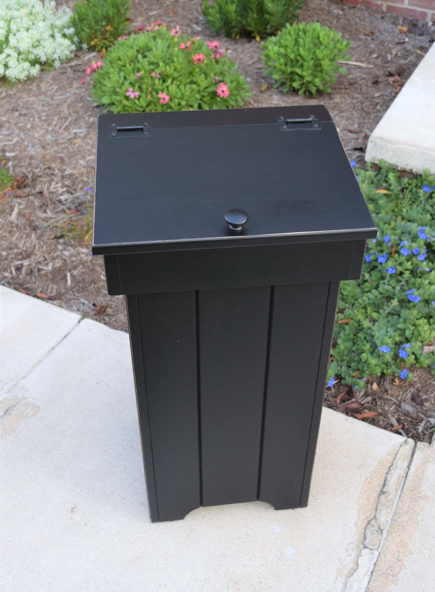 black upright trash bin