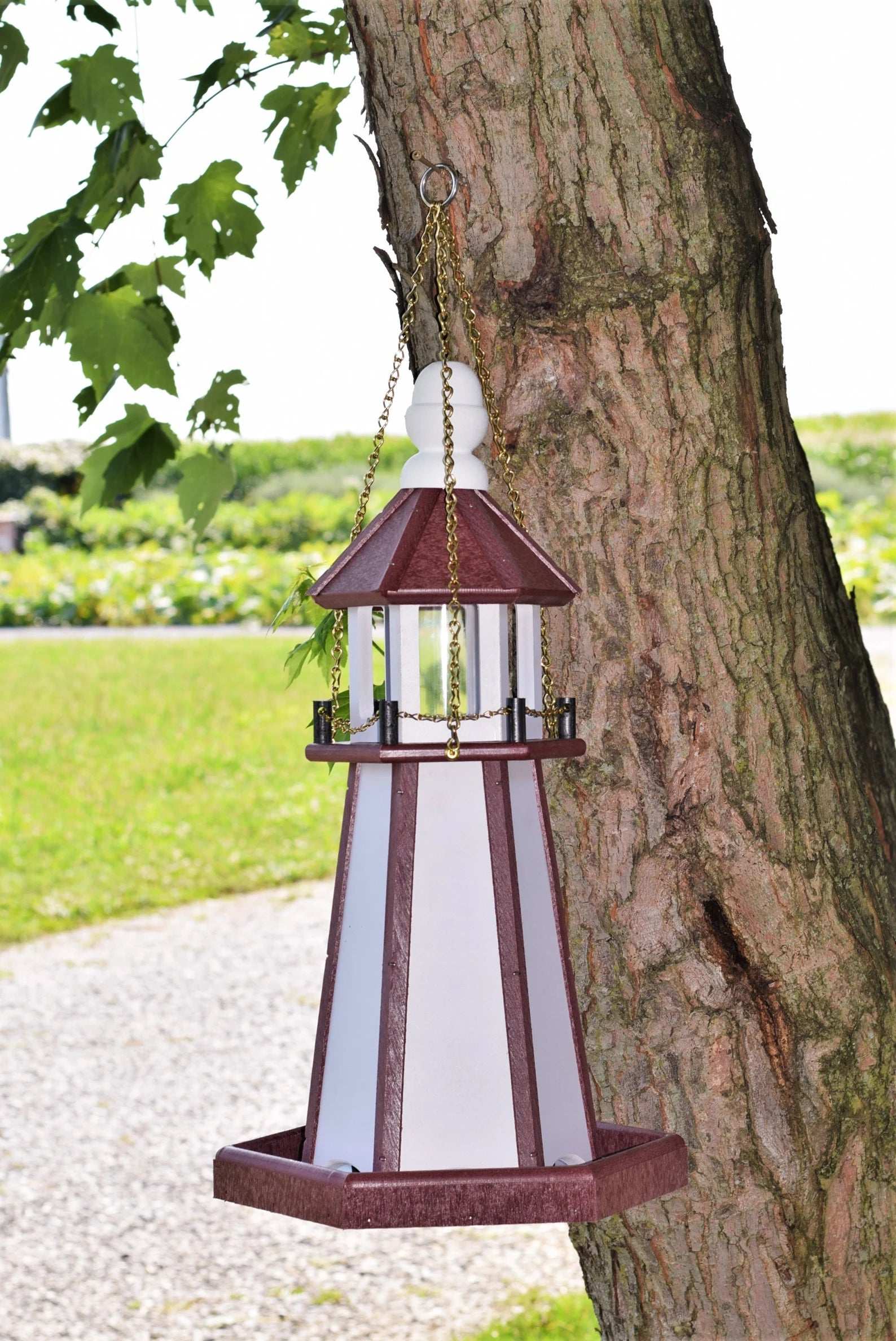 hanging white and red lighthouse bird feeder