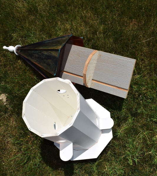 the inside of a tall patina roof birdhouse