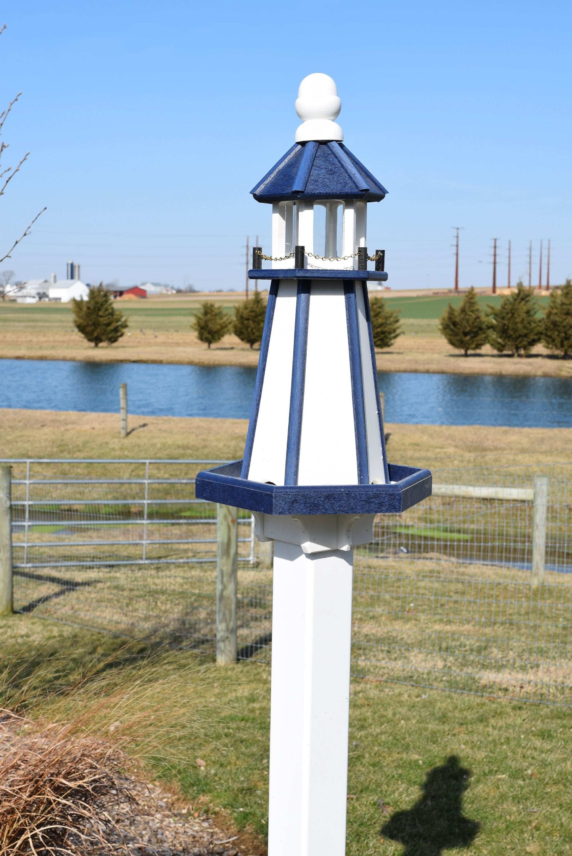 white and blue lighthouse poly bird feeder
