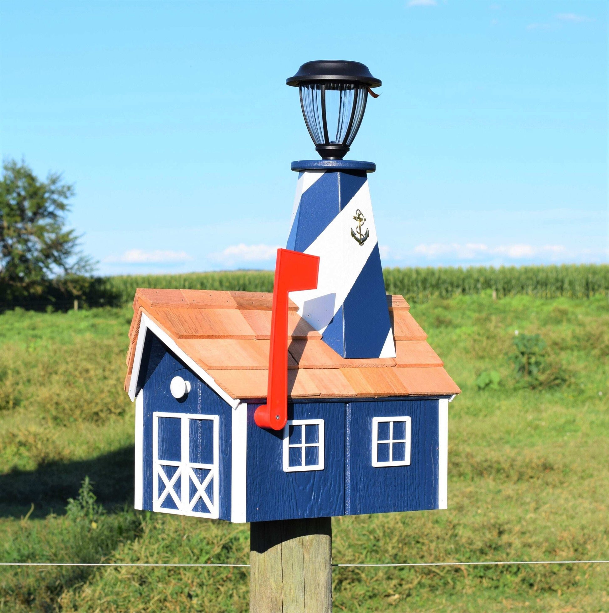 navy blue and white lighthouse mailbox