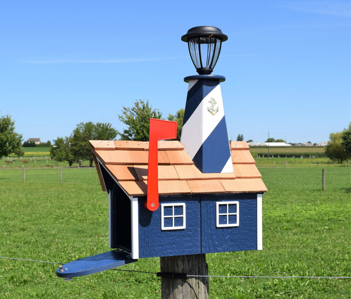 open door navy blue and white lighthouse mailbox