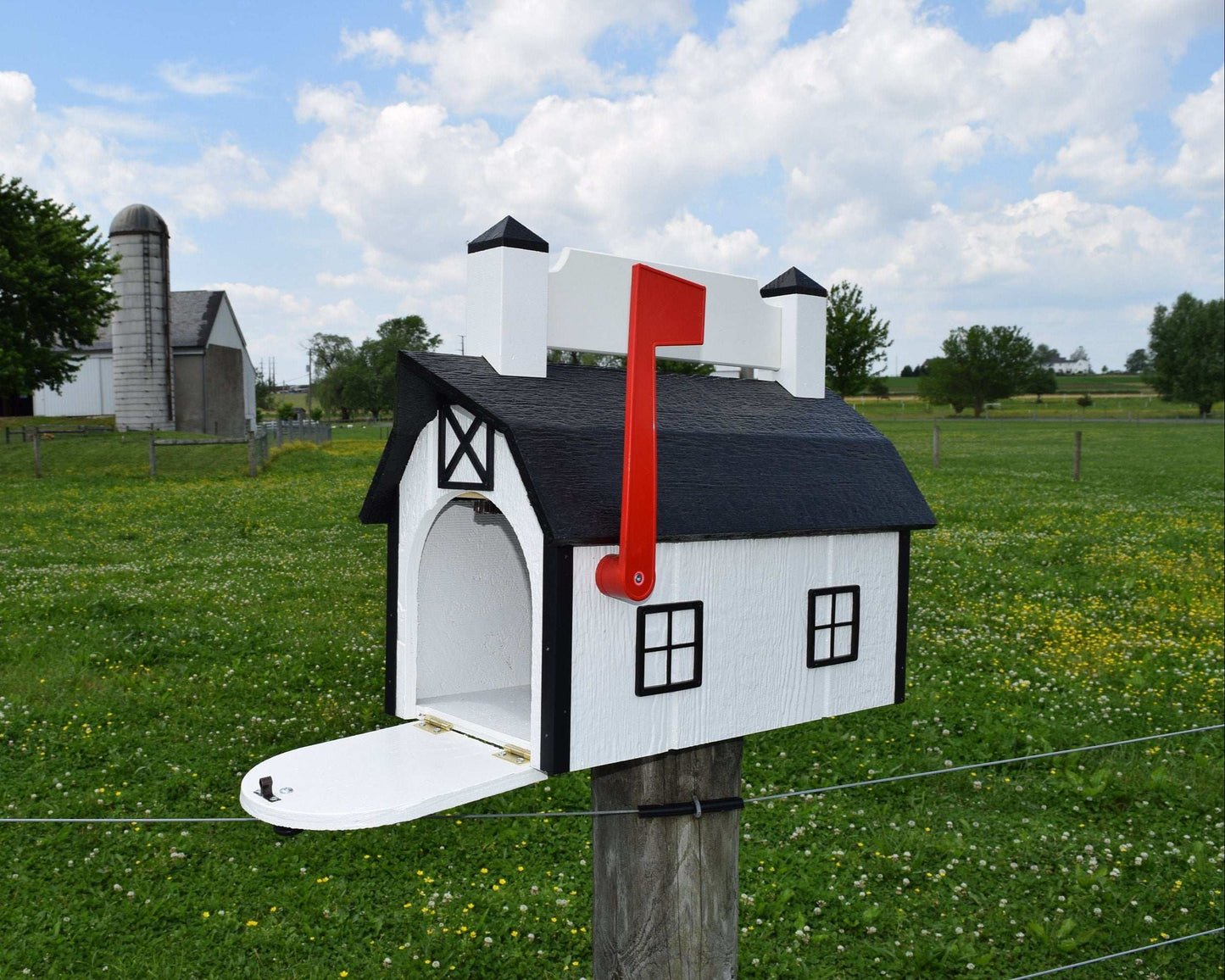 white and black nameplate barn mailbox