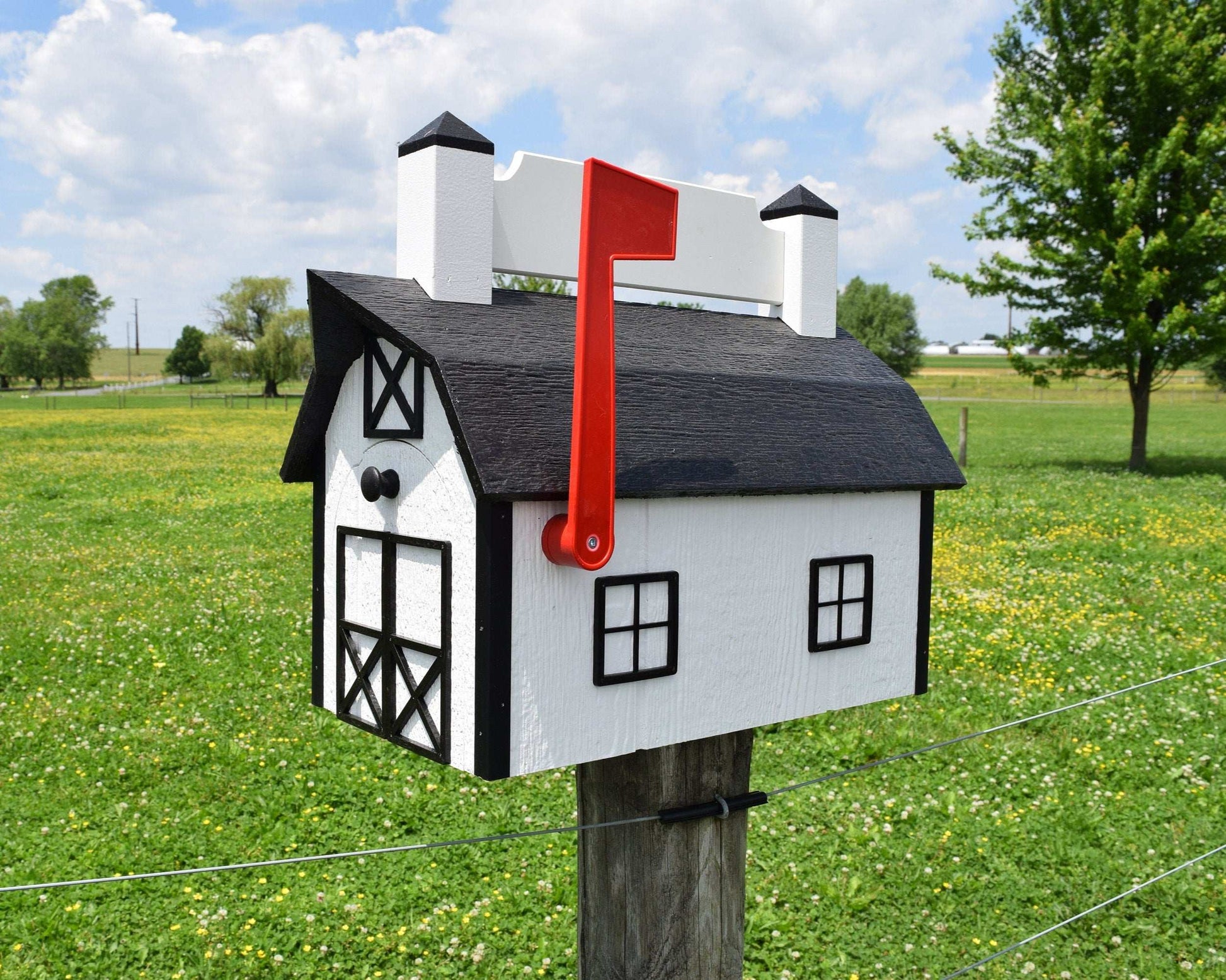 white and black nameplate barn mailbox