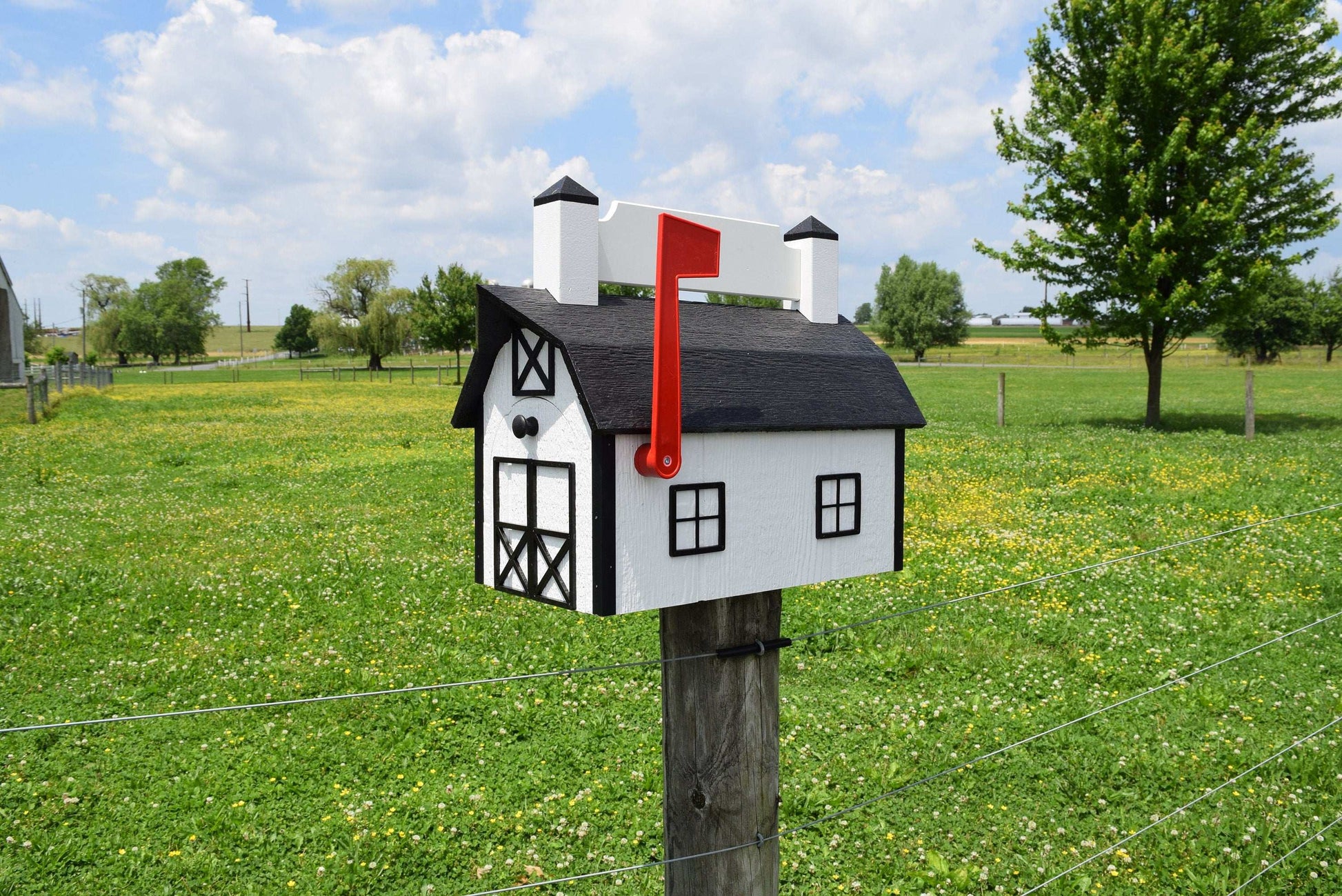 white and black nameplate barn mb