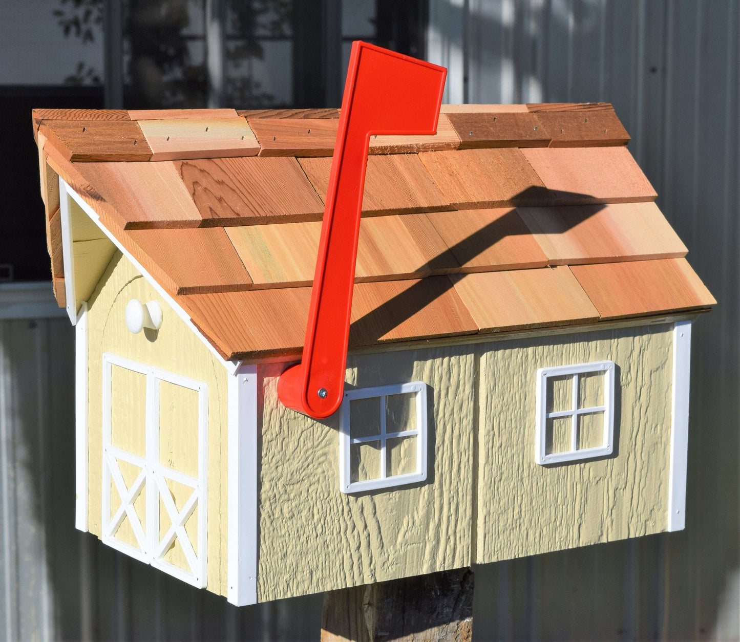 yellow and white amish mailbox