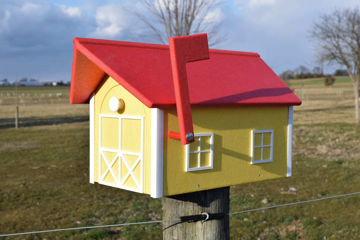 yellow white and red mailbox