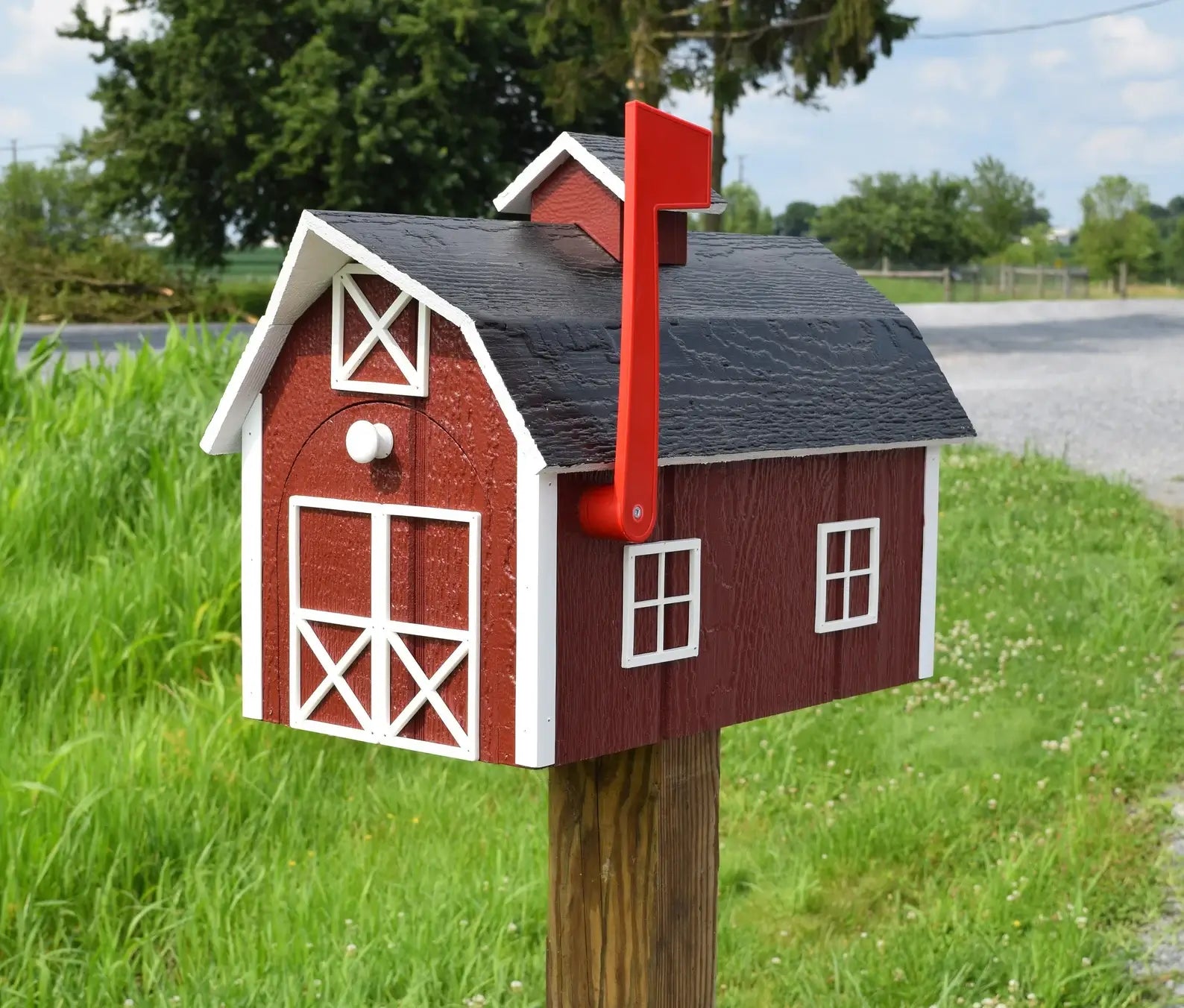 wooden barn mailbox. red and black
