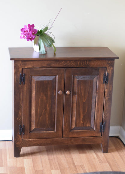 hall cabinet with staged plant