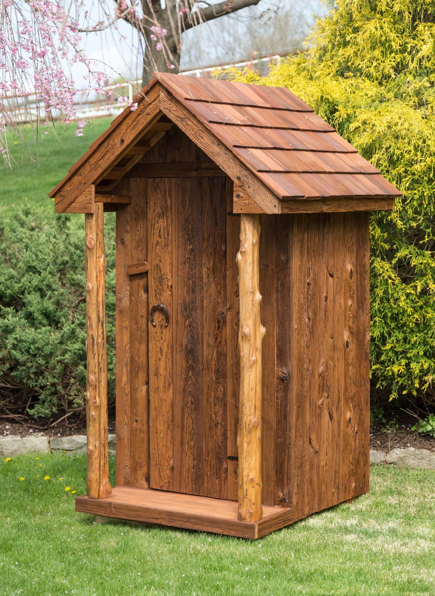 life size wooden outhouse