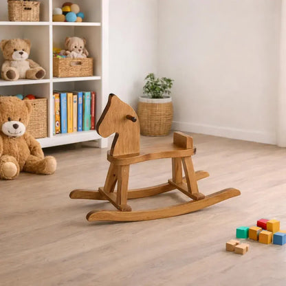 Wooden rocking horse in a room with toys and books