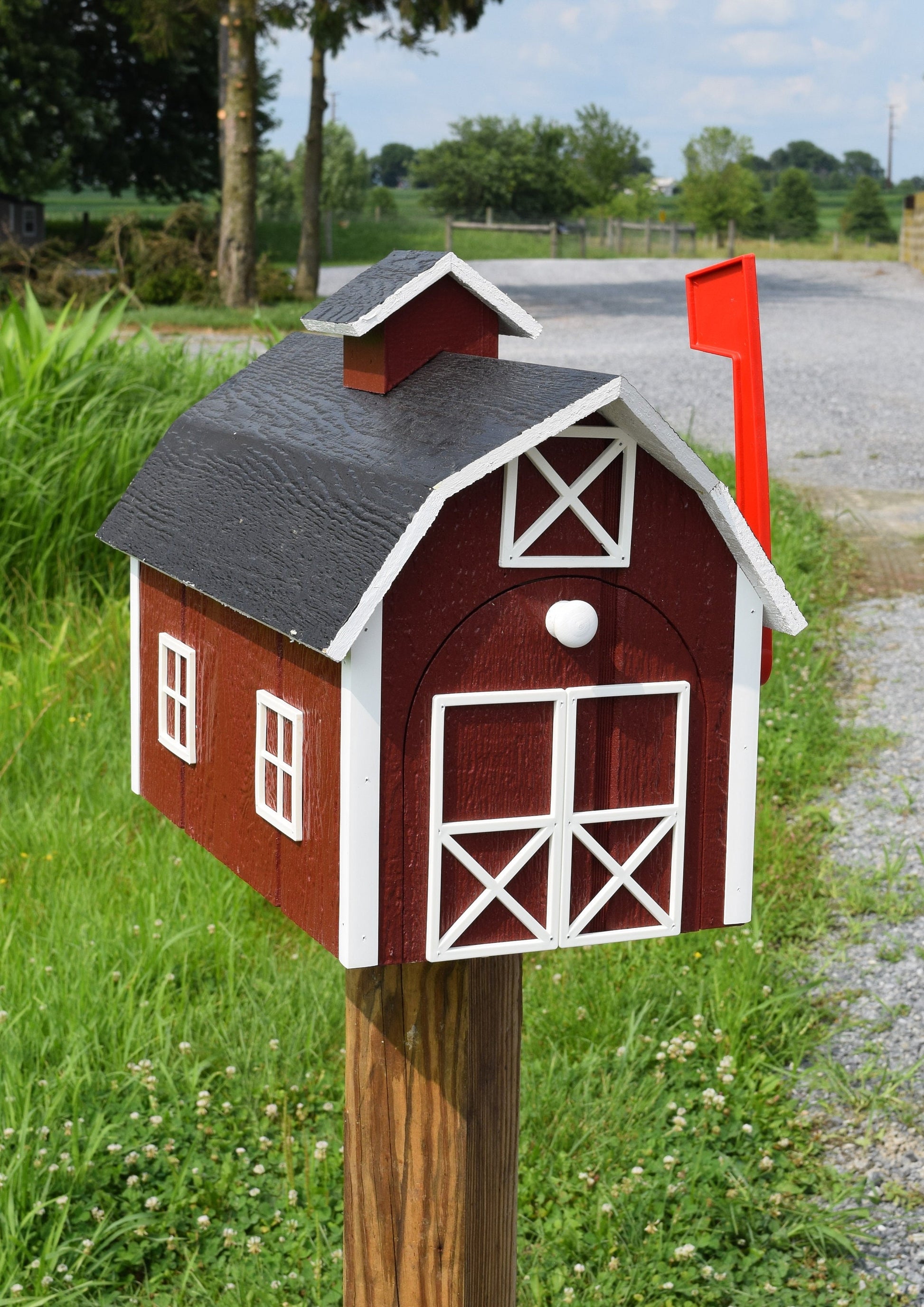 red barn mailbox with red flag