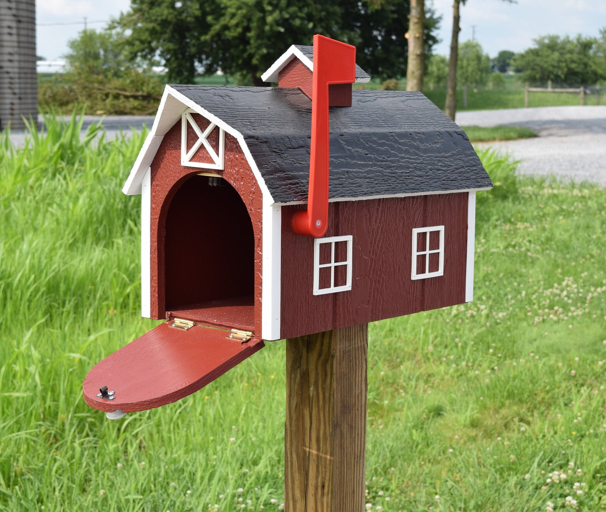 red barn mailbox with door open