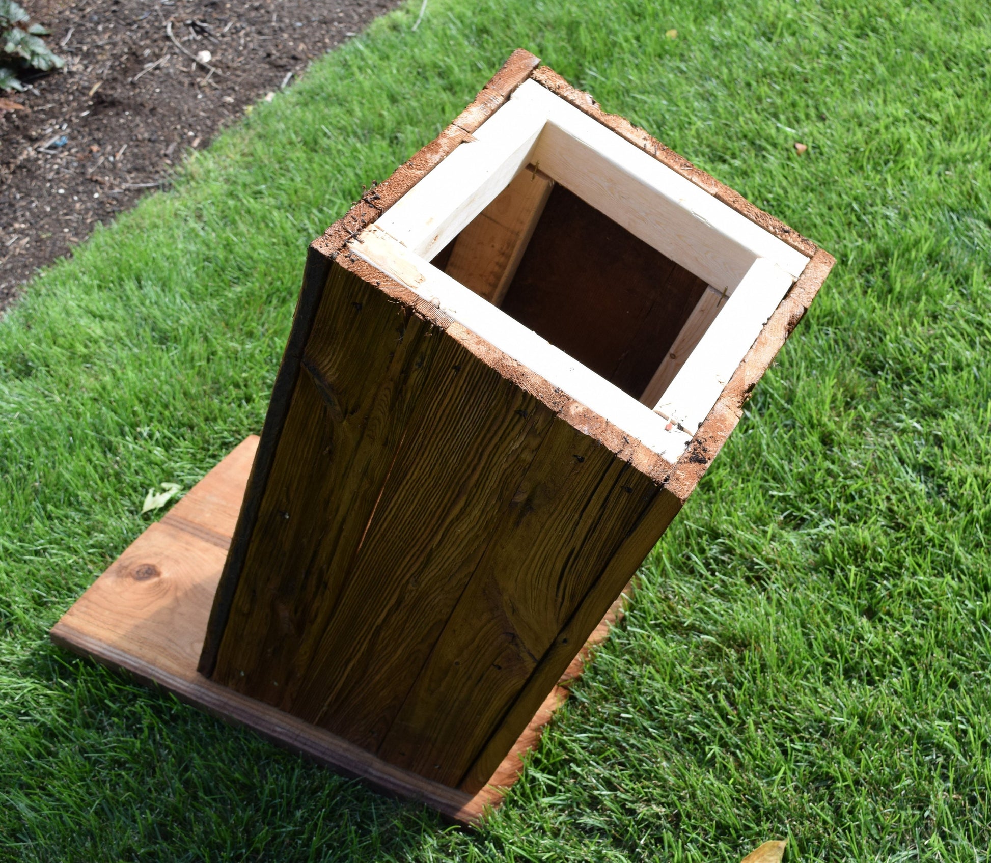 bottom opening of wooden outhouse